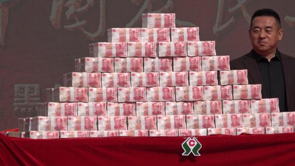 黑龙江“米姐”分红逾千万，用簸箕发钱