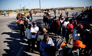 首批大篷车移民抵达美墨边境，5800名美国大兵严阵以待