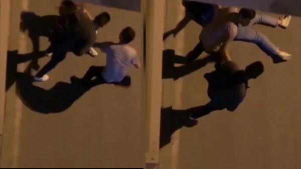 女子街头遭男子踢打躺地，网友拍视频