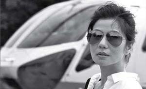 钟楚红办摄影个展，她的50幅照片拍出了怎样的香港