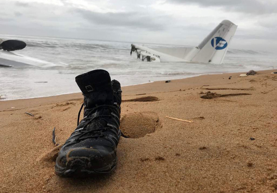 The wreckage of a propeller-engine cargo plane is seen after it crashed in the sea near the international airport in Ivory Coast's main city, Abidjan, October 14, 2017.