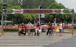 武汉街头现新款“过马路神器”：自动拉绳系统