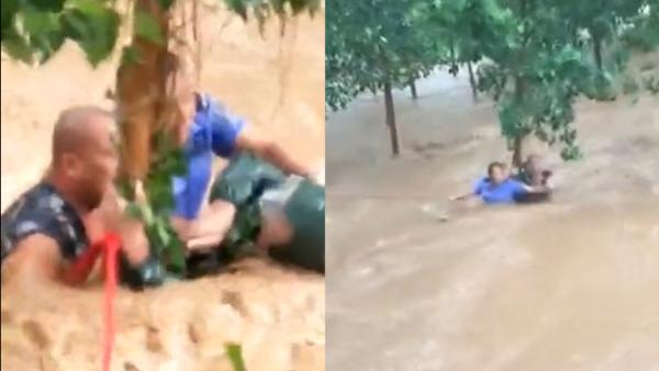 村民被困洪水中央，两辅警救人后瘫倒